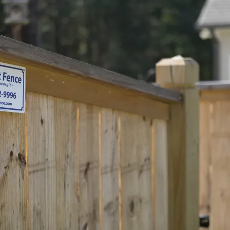 a sign on a wooden fence