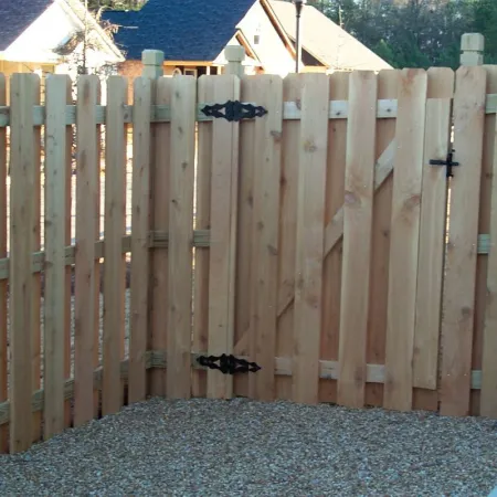 a fence with a group of birds on it