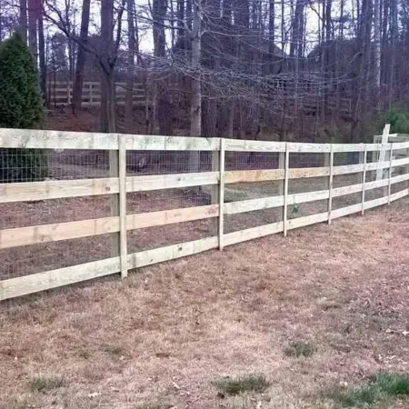 a white fence in a field