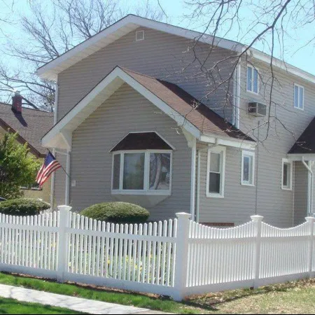 a house with a white picket fence