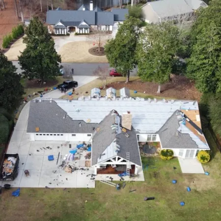 a house with a pool and trees around it