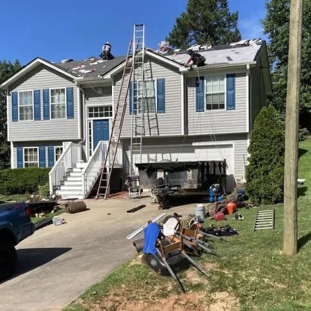 a house with a ladder and lawn