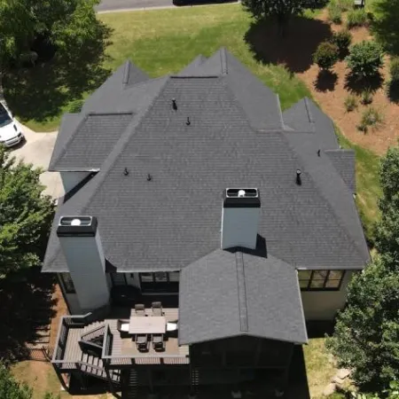 a house with a car parked in the driveway