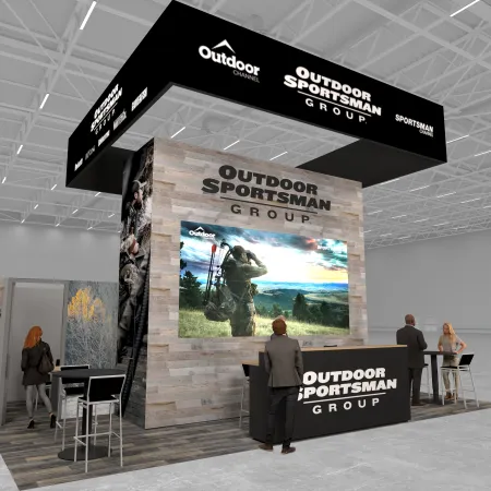 Modern Outdoor Sportsman Group trade show booth with large screen and branded displays in a spacious venue