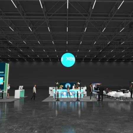 Spacious exhibition hall with Xero booths, digital displays, and attendees interacting under a high ceiling.