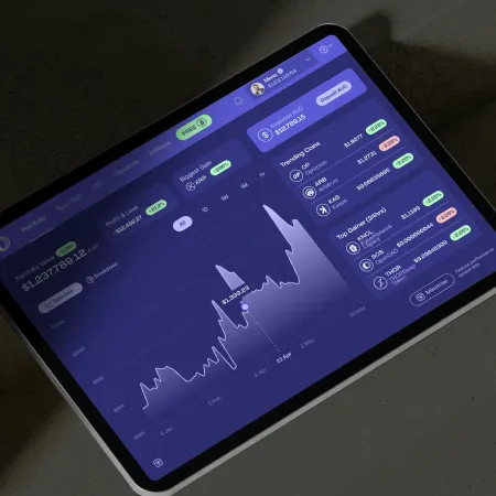 Tablet displaying a cryptocurrency portfolio dashboard with price graphs, trends, and coin details on screen.