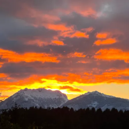 a mountain range with clouds