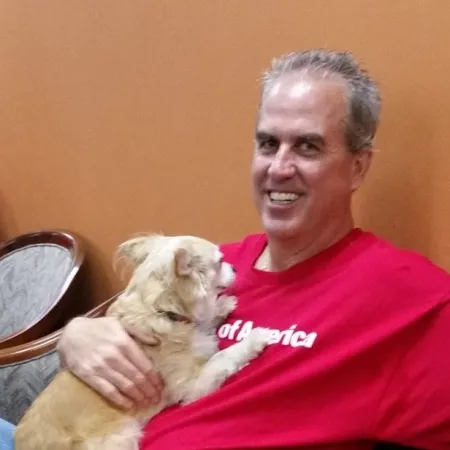 a person holding a dog