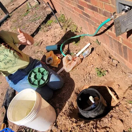 a person holding a shovel and a bucket of dirt
