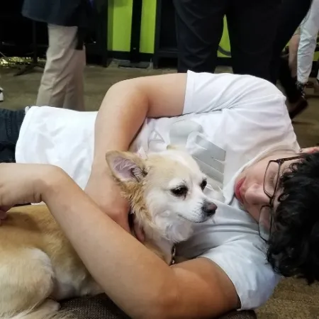 a person holding a dog