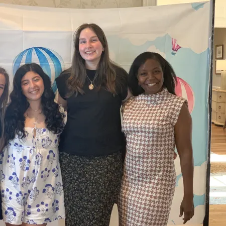 a group of women posing for a photo