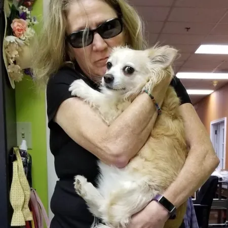 a person holding a dog