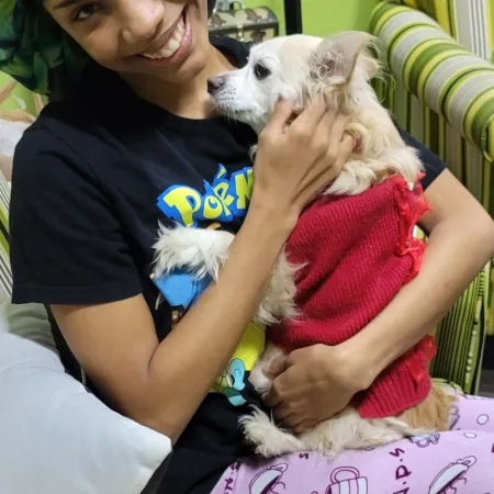 a woman holding a dog