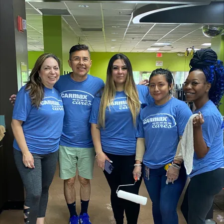 a group of people wearing blue shirts