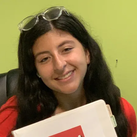 a woman holding a box