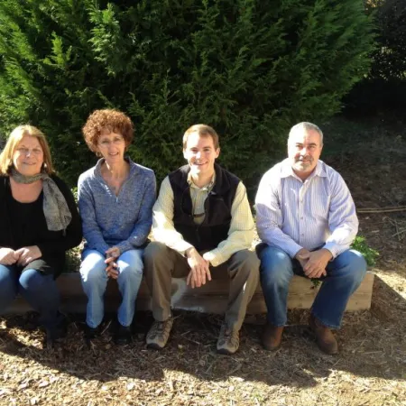 a group of people sitting on a bench
