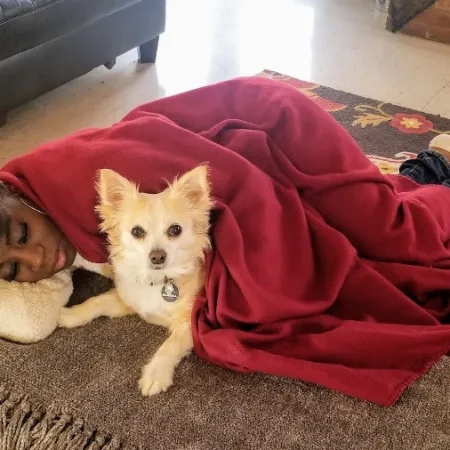 a person lying on a dog
