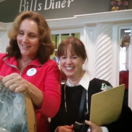 a couple of women smiling