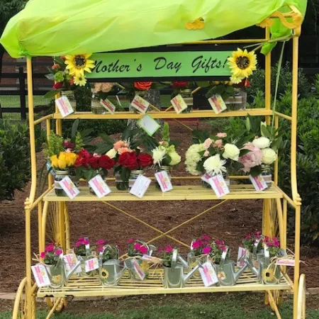 a grave with flowers and a flag