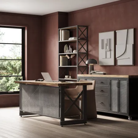 Modern industrial home office with metal shelves, wooden desk, abstract wall art, and large windows overlooking greenery.