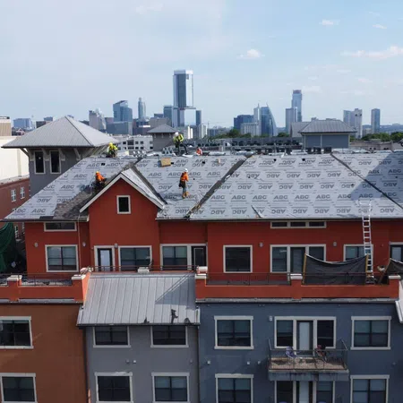 a group of buildings with snow on the roofs