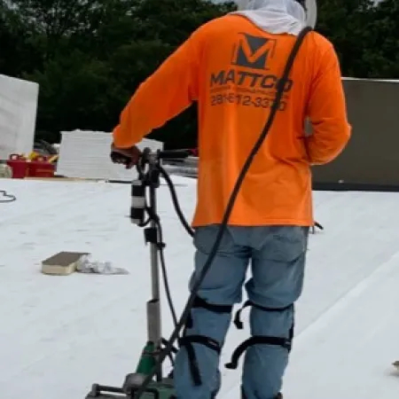 a man wearing a safety vest and holding a camera