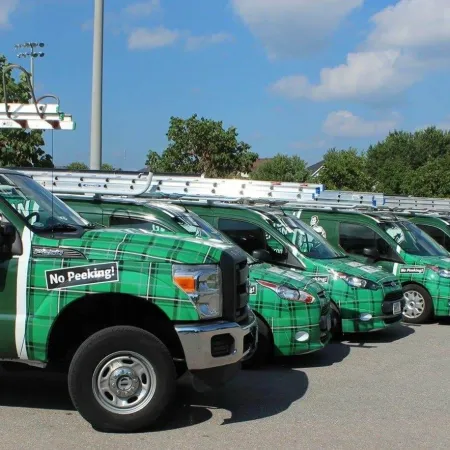 a row of green and white trucks