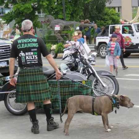 a man walking a dog on a leash