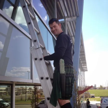 a man standing on a ladder