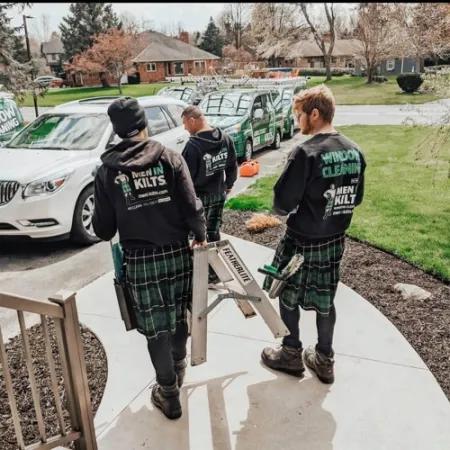 a group of people wearing kilts