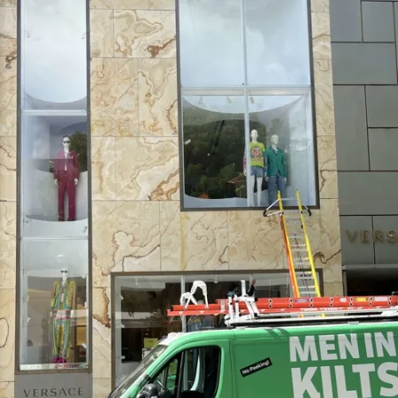 a building that has a window that has a ladder on it