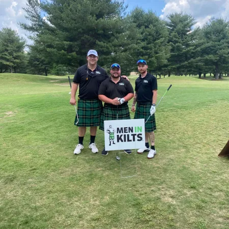 a group of men holding a sign