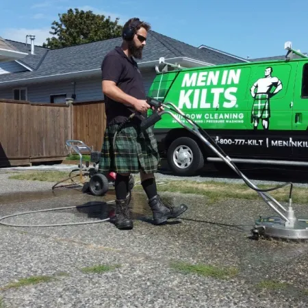 a person holding a large green machine