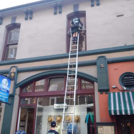 a tall ladder in front of a building