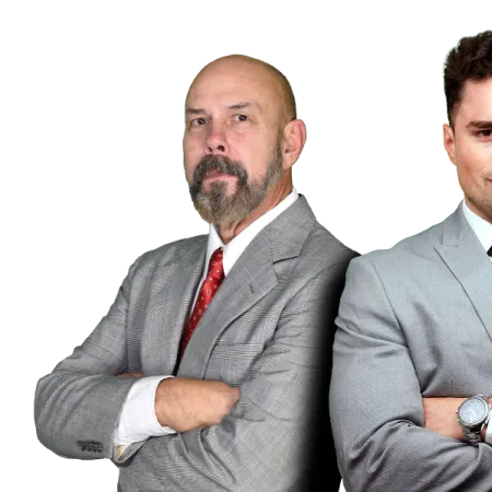 Two professional men in gray suits with arms crossed posing confidently against a black background