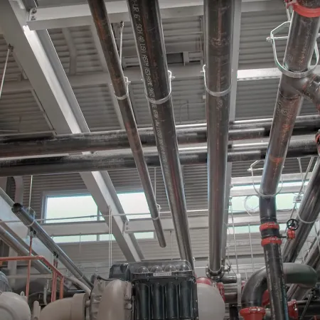 a large room with pipes and pipes