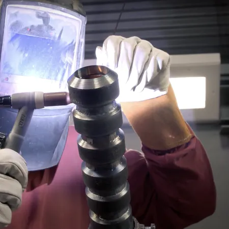 a person wearing gloves and gloves holding a microscope