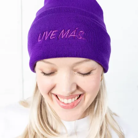 a girl wearing a purple hat
