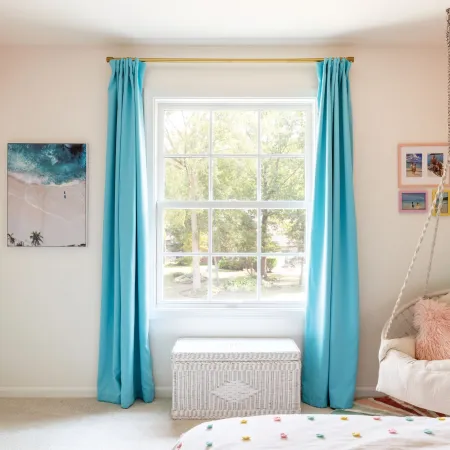Bright room with large white double hung window with SDL grids