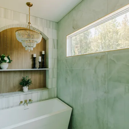 Modern bathroom with a rectangle picture window and natural light pouring through