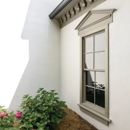 a double-hung fiberglass replacement window with privacy glass in a building