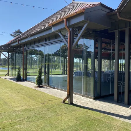 Atlanta Athletic Club maximizes the view and versatility of entertaining space with accordion style stacking glass doors