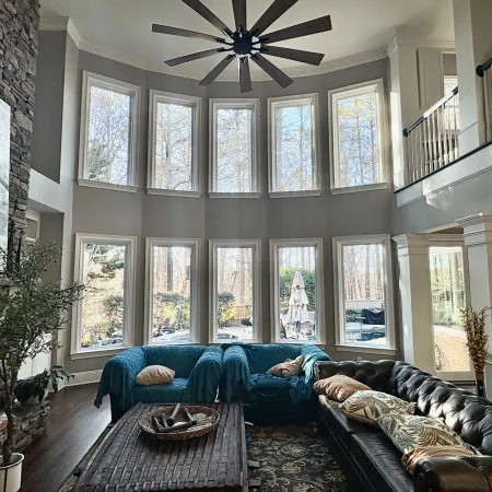 Two-story fiberglass picture windows in living room 