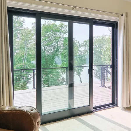Black sliding French door opening onto balcony