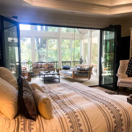 a large bedroom with a large window