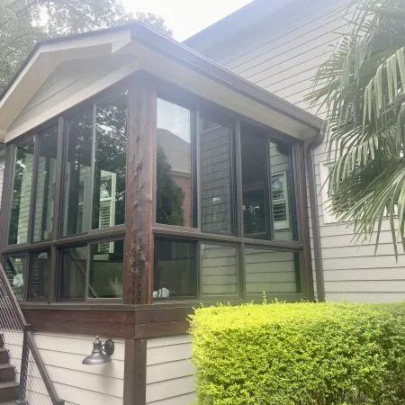 a house with an enclosed porch with fiberglass slider windows for ventilation offers a comfortable space despite the season