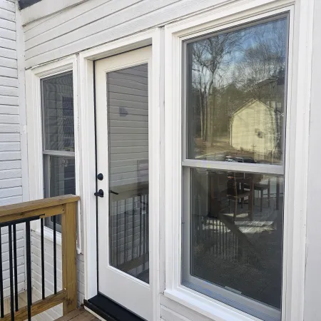 White fiberglass hinged patio door 