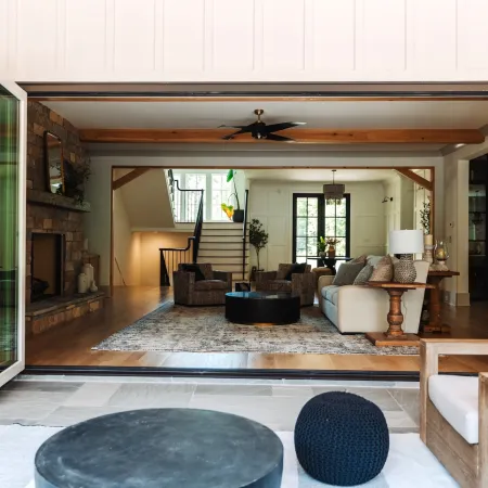 Open bifold doors connect living room with outdoor living space