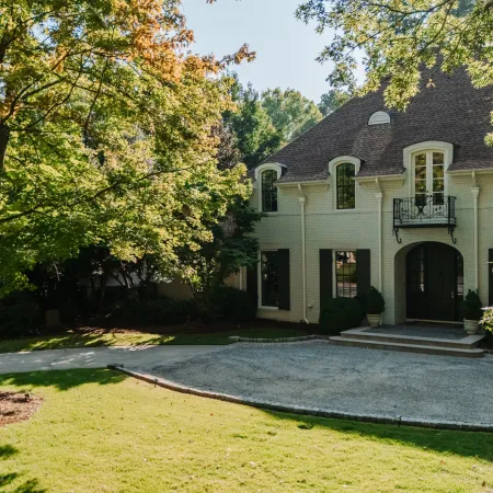 a house with trees in the front