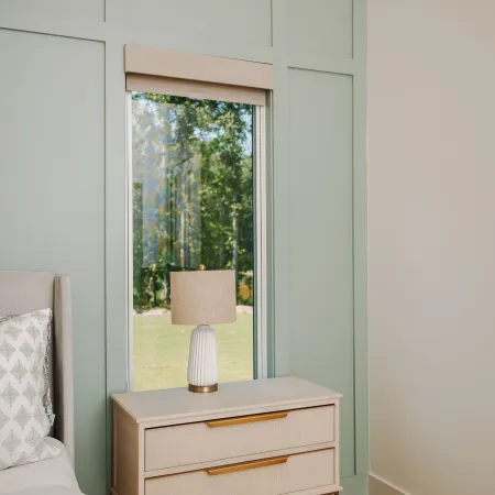 a room with a window and a bed